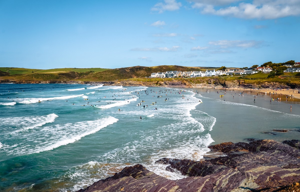 Sunny afternoon on Polzeath beach with waves rolling in